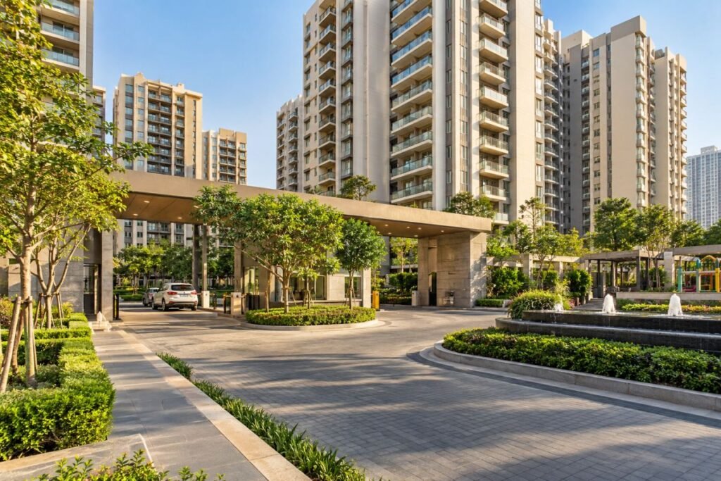 Residential apartment complex in Gurugram with landscaped common areas and organised building access.